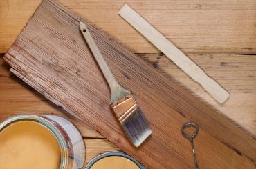Can you paint over stained wood.