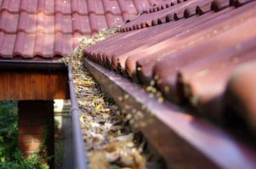 Tips for cleaning rain gutters on a 2-story house.