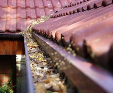 Tips for cleaning rain gutters on a 2-story house.