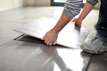 What is the best adhesive for loose floor tiles.