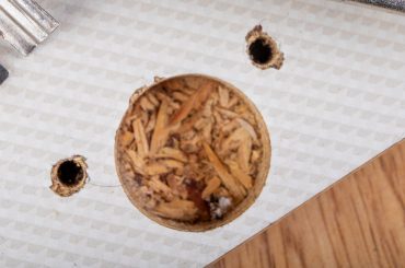 How to fix screw holes in cabinets.