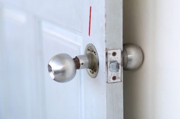 A damaged doorknob that will soon fall off.