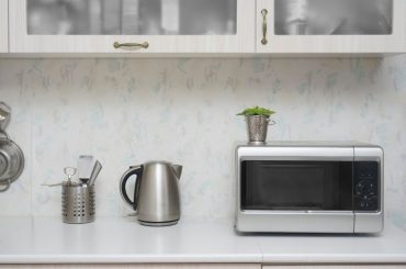 Compact microwave oven in a small kitchen.