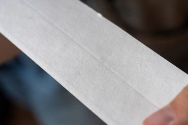 Paper tape for sealing drywall seams.