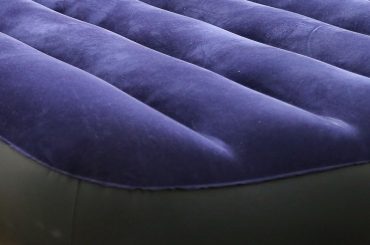Fixing a hole in an air mattress seam.