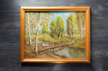 Hanging a heavy framed picture without using nails.