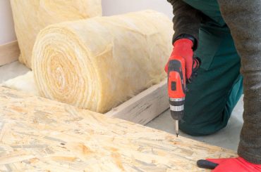 Installing floor insulation.