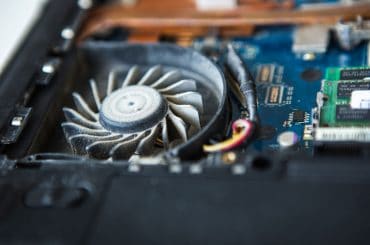 A dusty laptop fan making a buzzing noise.