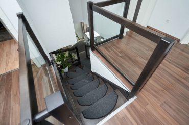 Using non-slip carpet treads to make wooden stairs less slippery.