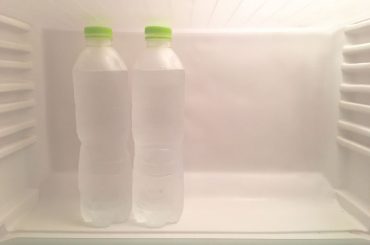 Frozen water bottles in a freezer.
