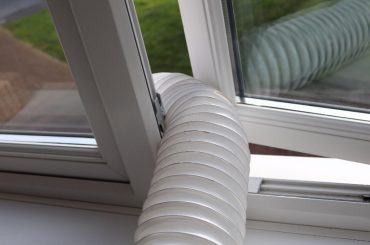 Venting a dryer without a vent to outside. Dryer hose hanging through the window.