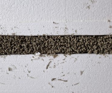 EPS concrete made from EPS beads, cement and water for covering pipes and cables.